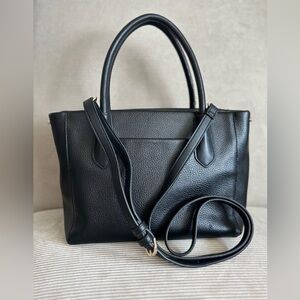 A New Day - a black faux leather satchel